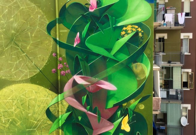 Big wall painting on building with green leaves and pink flowers. Aerosol art by Dado