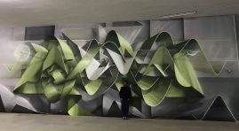 Dado ribbons wildstyle at Minarelli's Garage in Cortina D'Ampezzo, front view with the artist posing in the middle