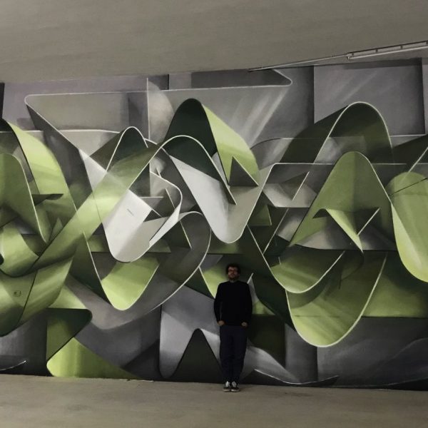 Dado ribbons wildstyle at Minarelli's Garage in Cortina D'Ampezzo, front view with the artist posing in the middle