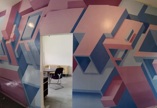 Air Tec factory name lettering wall decoration by Dado - total view with door