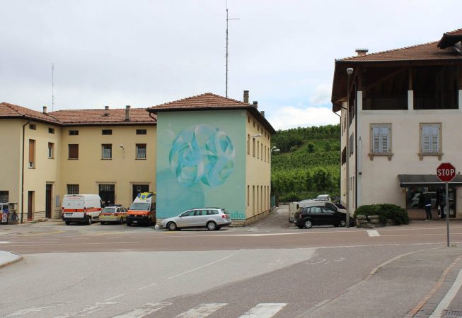 Sfera fiocco di neve by Dado artwork on wall in Cles - aerosol art - wide location street view