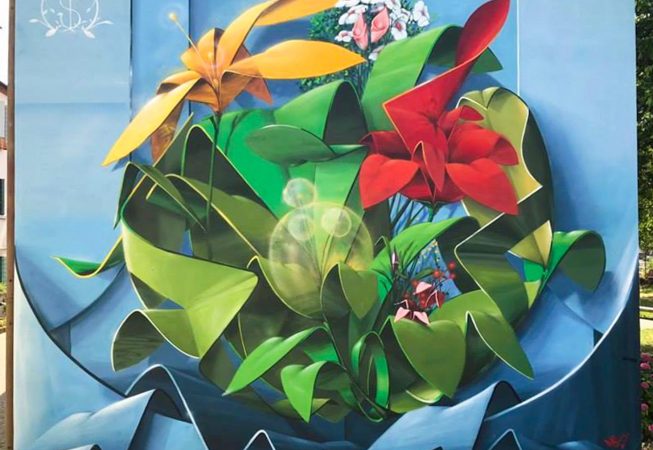 Graffiti-mural painting spheric lettering with multi colored flowers-front view. Artwork by Dado