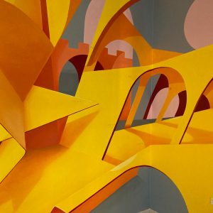 Detail of an interior wall decoration representing an abstraction of Bologna's arcs, Portici in yellow-orange tones. Artwork by Dado.