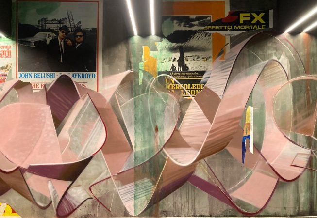 Detail of torn paper posters as a part of a decorated garage interior walls recreating a street underground atmosphere. Artwork by Dado.