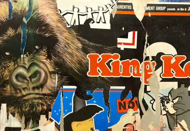 Detail of torn paper posters as a part of a decorated garage interior recreating a street underground atmosphere. Artwork by Dado.