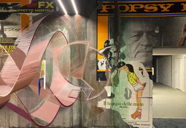 Detail of a decorated garage interior recreating a street underground atmosphere with spraycan lettering artworks and torn paper posters. Artwork by Dado.