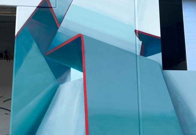 Close-up detail of a graffiti paint work on the external walls of a big building representing flat ribbons bent in geometrical shapes, light blue and white shades with thin red outlines. Artwork by Dado