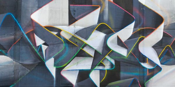 Mural painting representing weaving stiff ribbons forming the name of the artist Dado, in dark grays and white tones with sharp cutting multi color outline. Core detail