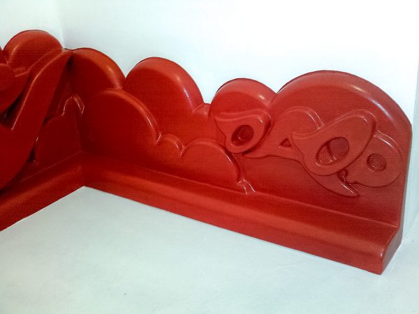 Bas-relief in the form of a baseboards graffiti representing the names Dado and Stefy.Detail. Artwork by Dado and Stefy