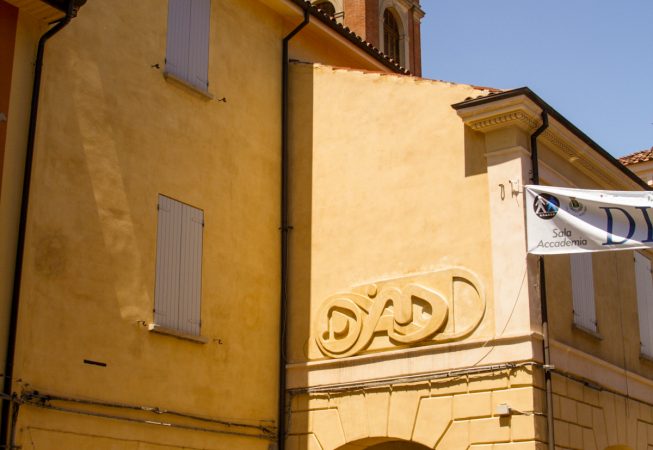 Bas-relief sculpture in a contemporary graffiti lettering fixed on a above a Medieval vault architecture well pairing. Total view. Artwork by Dado