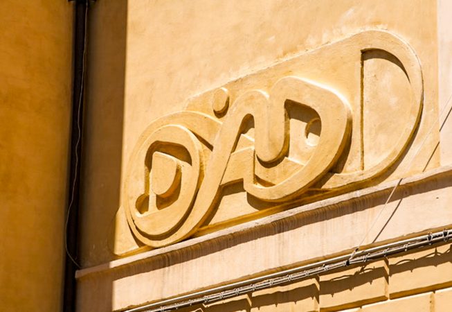 Bas-relief sculpture in a contemporary graffiti lettering fixed on a above a Medieval vault architecture well pairing. Detail from bottom right. Artwork by Dado