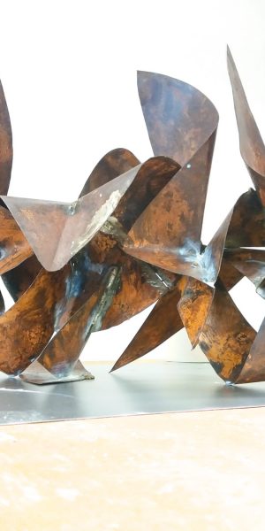 Sculpture made of bent and torched copper ribbons in original copper color with some oxidation stains and welding marks. Artwork by Dado