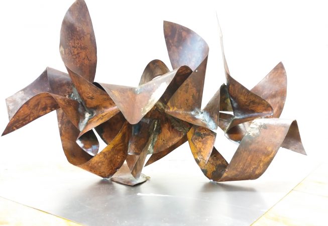 Bent and torched copper ribbons in original copper color with some oxidation stains and welding marks. Artwork by Dado