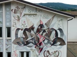 Closer detail of a mural painting depicting the graphic studies for any single letter forming the name Dado in a graffiti wildstyle piece, front aereal view