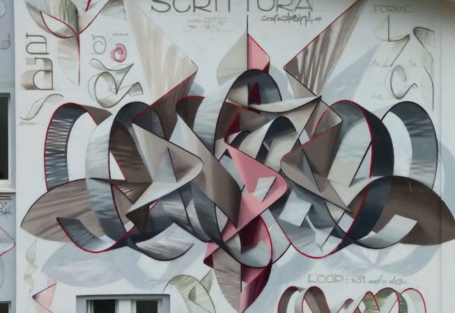Central detail of a mural painting depicting the name Dado in a graffiti wildstyle piece, front view