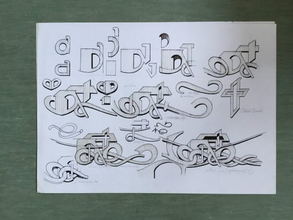 Marker sketches on white paper illustrating studies on the graphic elements composing lettering drawings in a graffiti artwork. Sketches by Dado Ferri