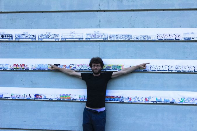 Dado leaning against the wall with drawing exposed