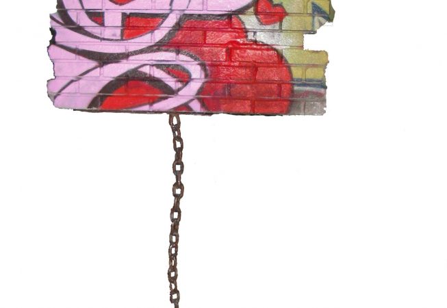 A modern art sculpture consisting in a square piece of a brick wall painted with graffiti floating off the ground trying to fly away but a strong heavy chain keep it connected to the ground. Artwork by Dado